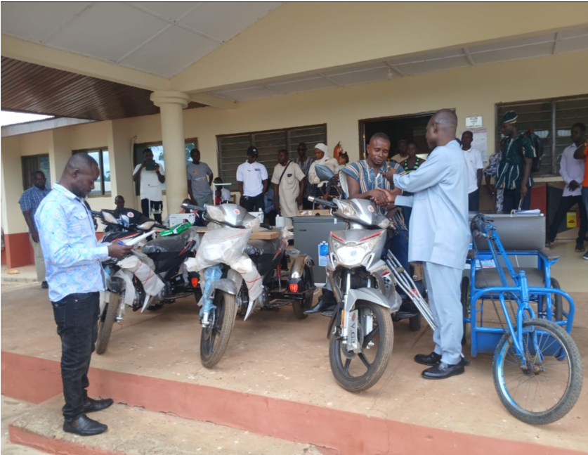 Hon Adamu Sayibu(DCE) supports PWDs with various items including Motor Bikes, Refrigerators, laptops, Cheques and many others to enable them have a responsive life style